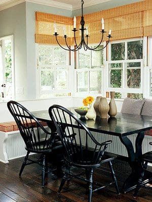 banquette with Windsor chairs and chandelier