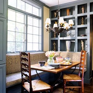 banquette in a blue nook with shelving