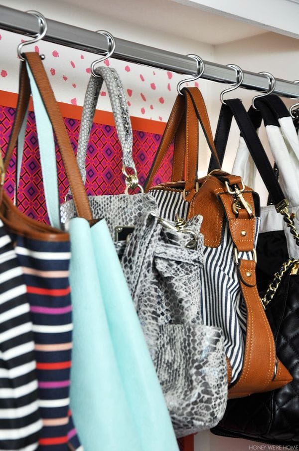 Organized purses hung from shower hooks - genius! 