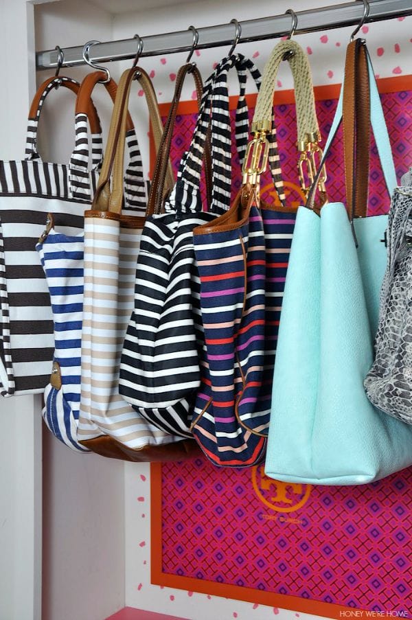 Organized purses hung from shower hooks - genius! 