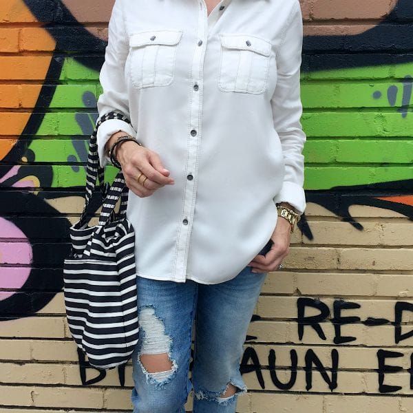 Fall fashion - white button down, ripped jeans, and great bag 