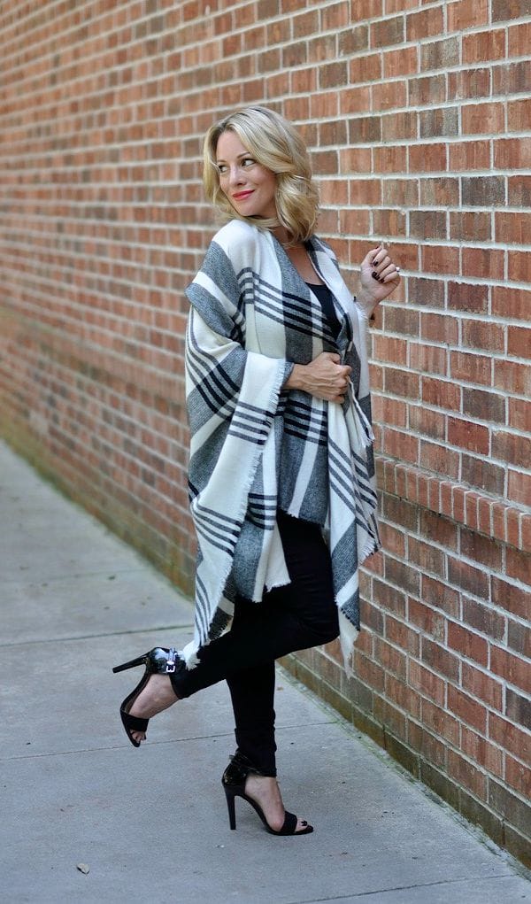 Fall Fashion - black and white plaid poncho with black skinny jeans and heels 