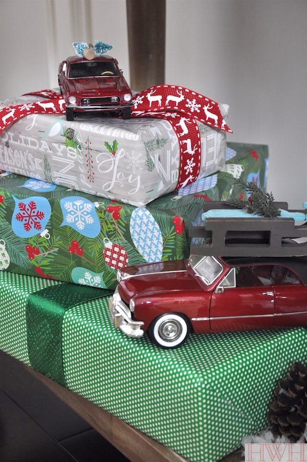 Festive holiday decor using real toys like these red cars and sled & tree ornaments | Honey We're Home