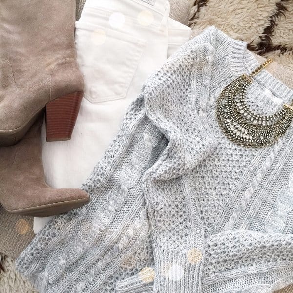 Cable knit sweater, white jeans, boots and necklace.
