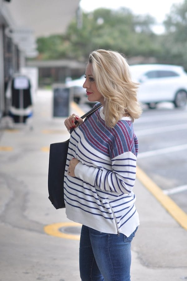 Lightweight striped sweater with zipper accent.