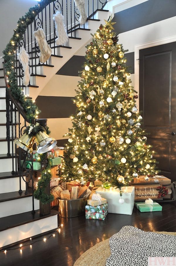 Sparkly Christmas Tree with metallic ornaments and faux fur stockings | Honey We're Home