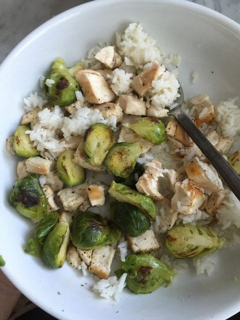 Chicken, rice and roasted brussel sprouts.