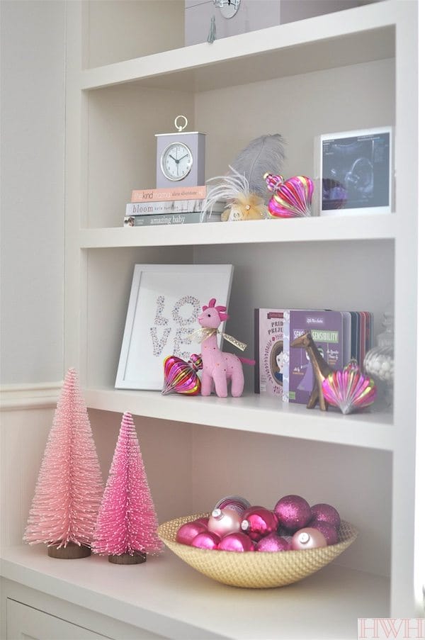 Festive holiday nursery with pink Christmas trees and ornaments. | Honey We're Home