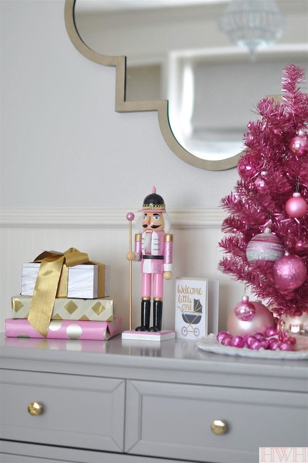 Festive holiday nursery with pink tinsel tree and pink nutcracker | Honey We're Home