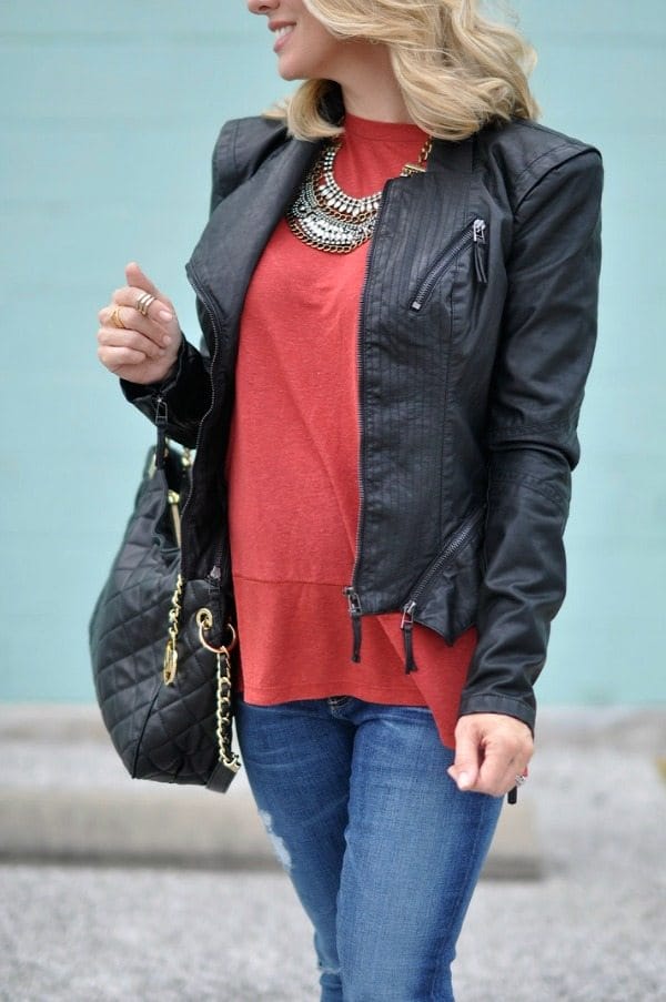 Pregnancy update 23 weeks.  Leather Jacket, jeans, bag and necklace.