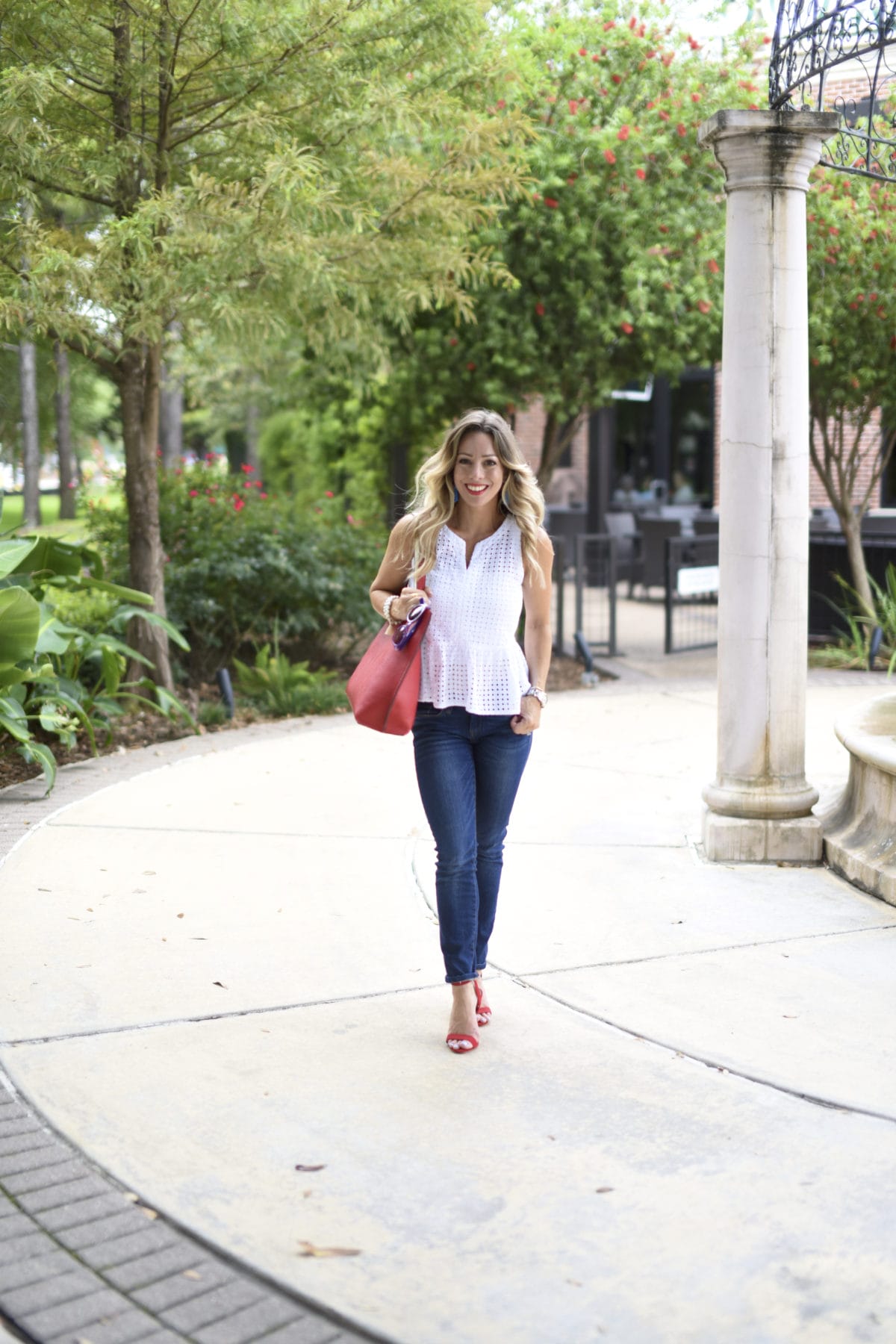 white eyelet top jeans red heels