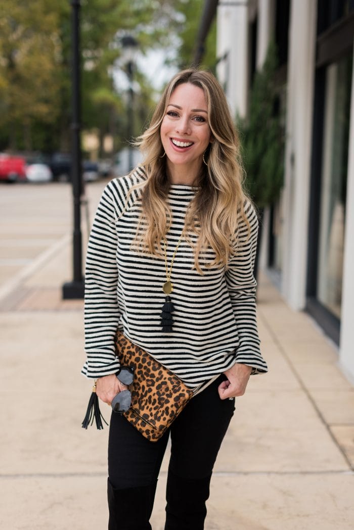 Thanksgiving Outfit - black jeans, boots, striped tunic and leopard clutch