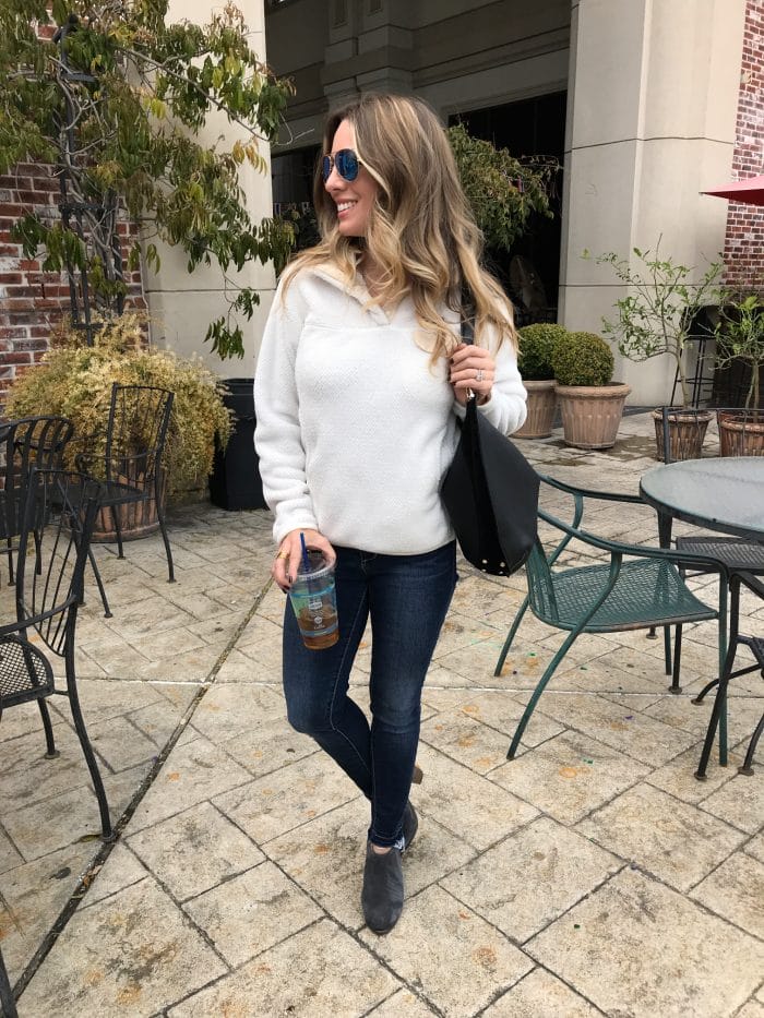 Casual Outfit - Patagonia pullover with high waist skinny jeans and booties