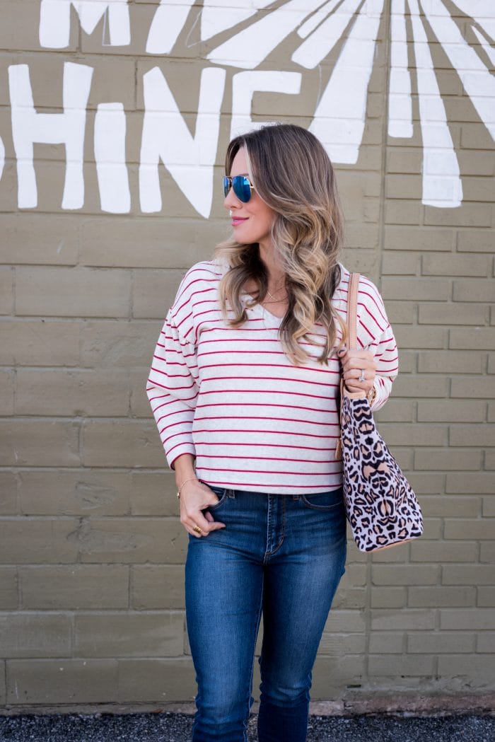 striped top and jeans with red heels