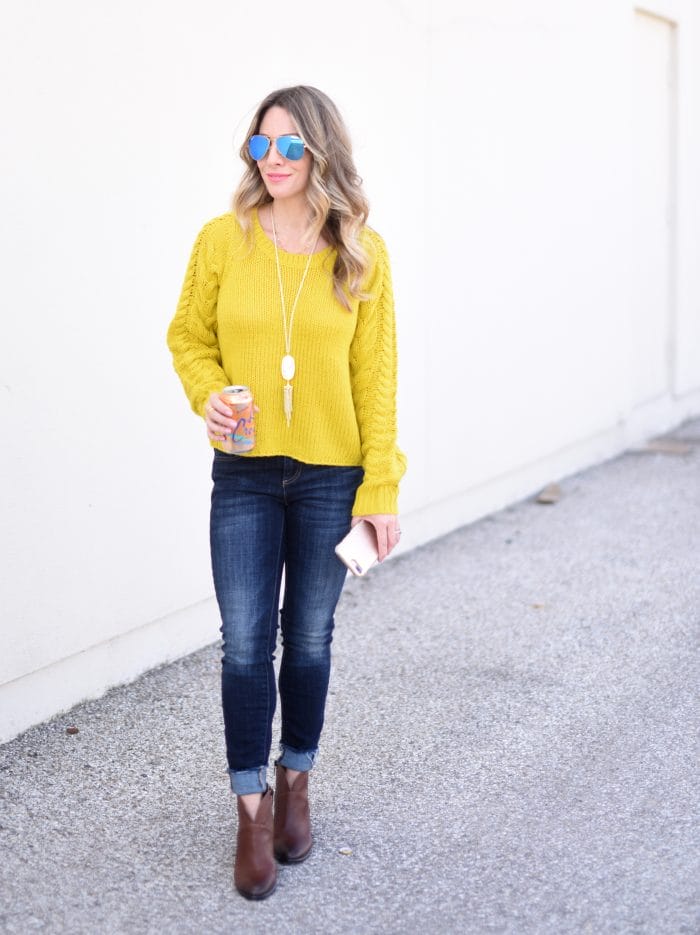 yellow cable knit sweater and jeans with booties