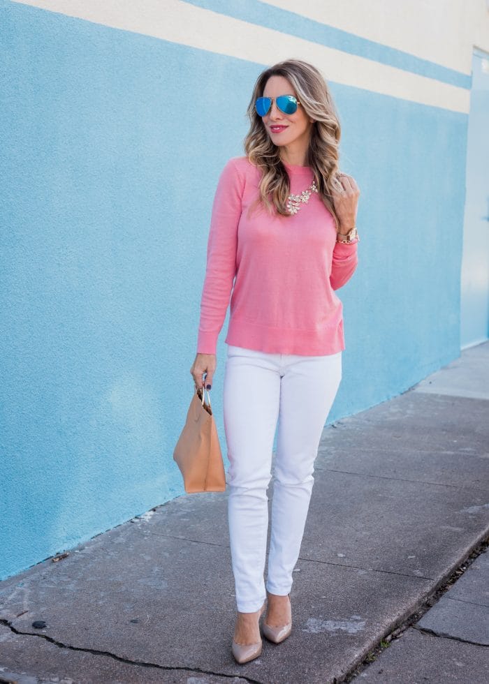 Transitional Spring Outfit- bow back sweater with white jeans, heels and tan bag 