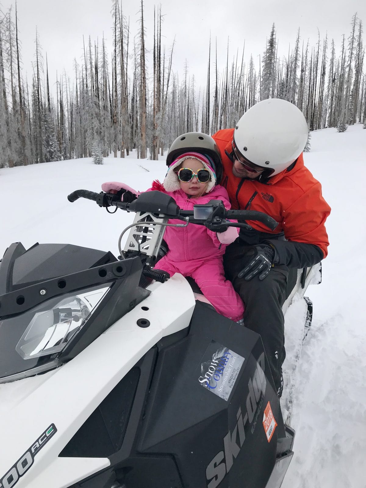 Family ski trip with a toddler - snowmobiling 