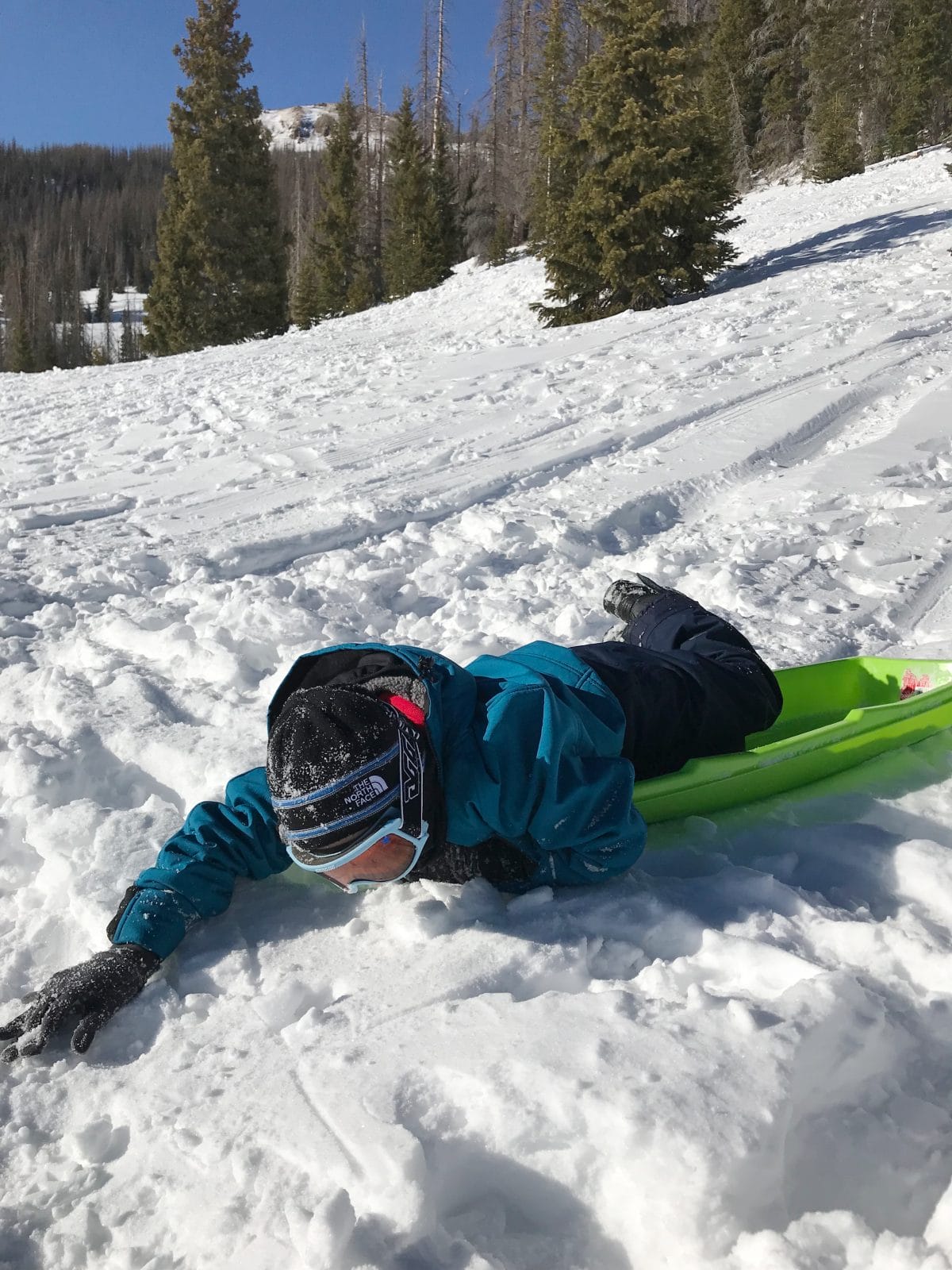 Family ski trip with toddler - sledding 