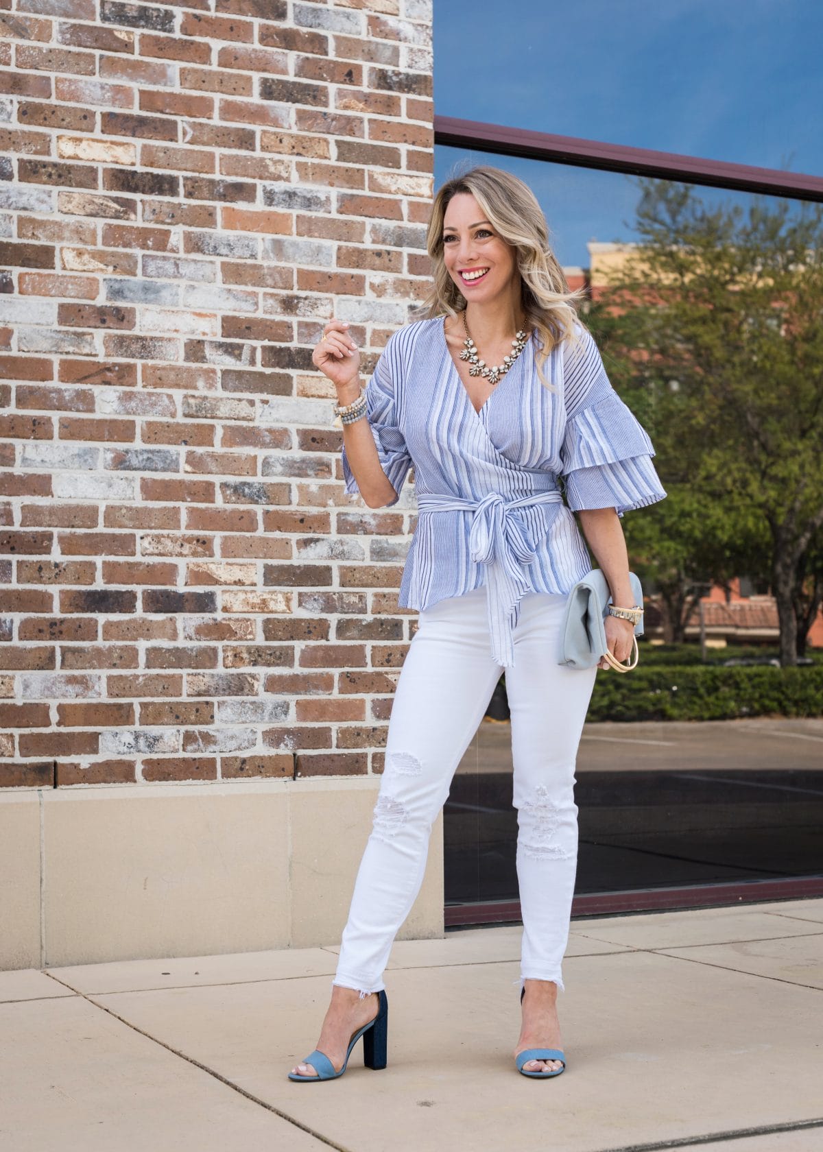 Spring Outfit - blue wrap ruffle sleeve top and white jeans 9