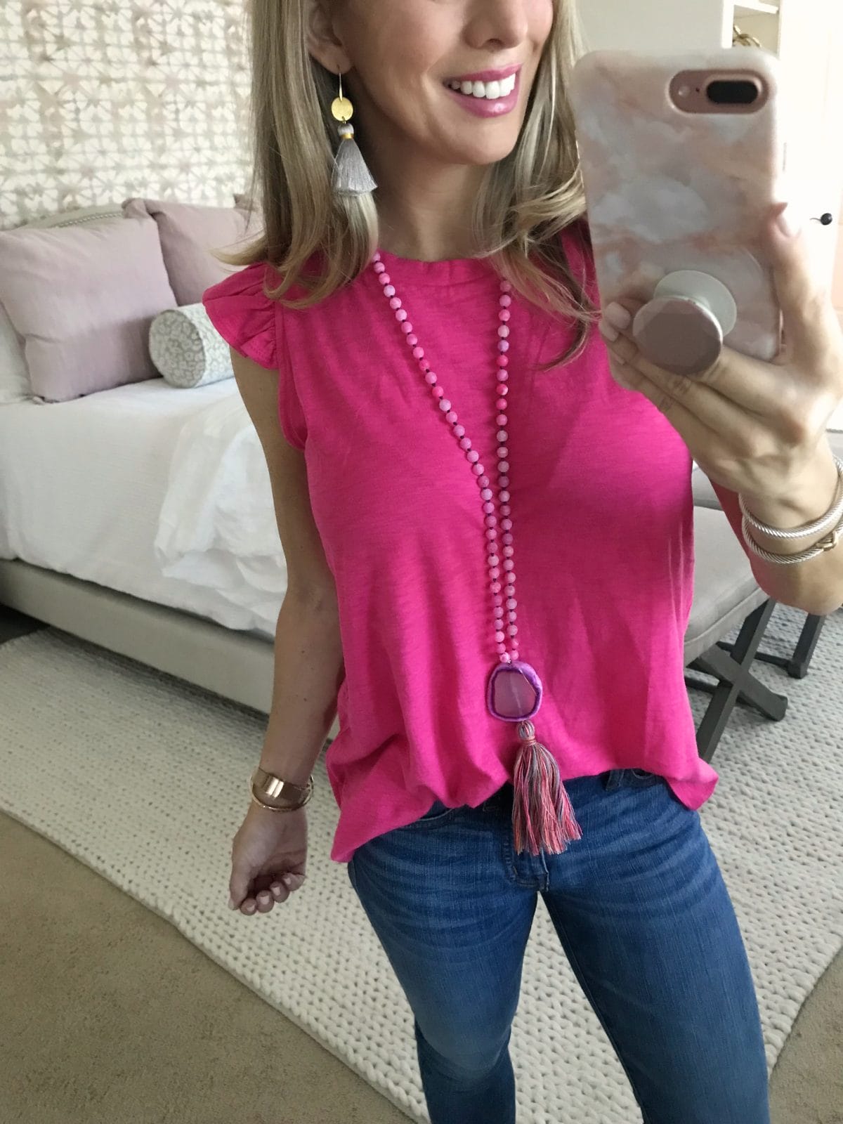Hi Sugarplum x Gibson pink flutter sleeve top and jeans with tassel necklace and tassel earrings