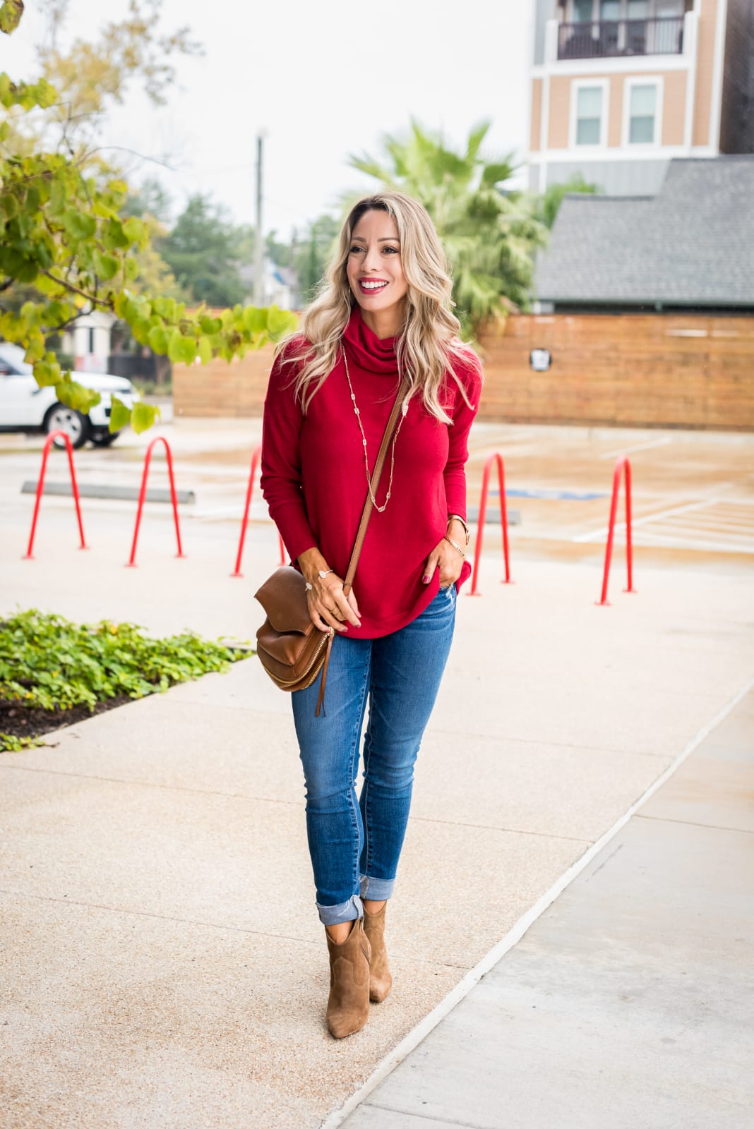 Cute Fall Outfit with red pullover, jeans and booties