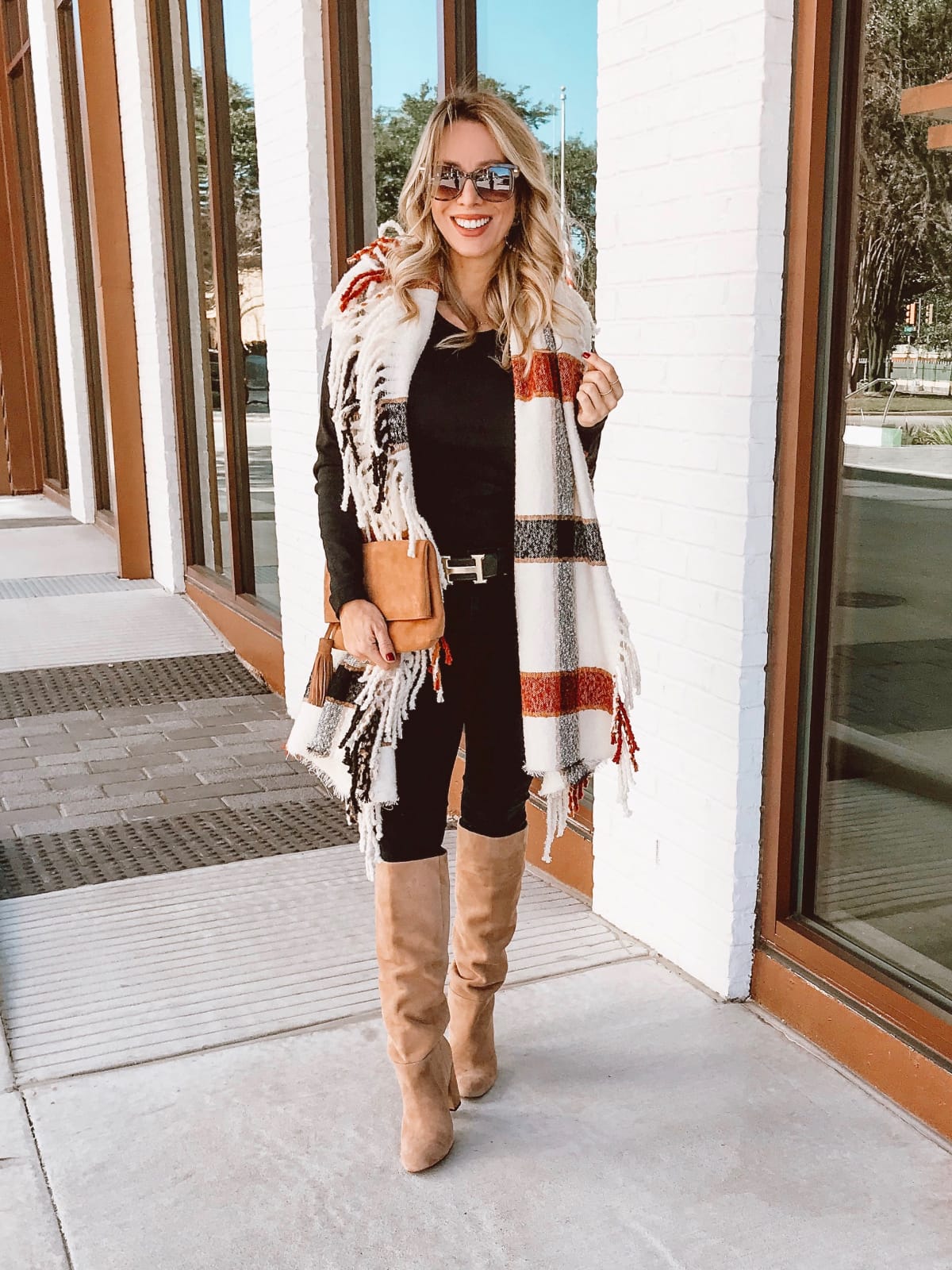 Winter outfit - fringe scarf black jeans and tall boots