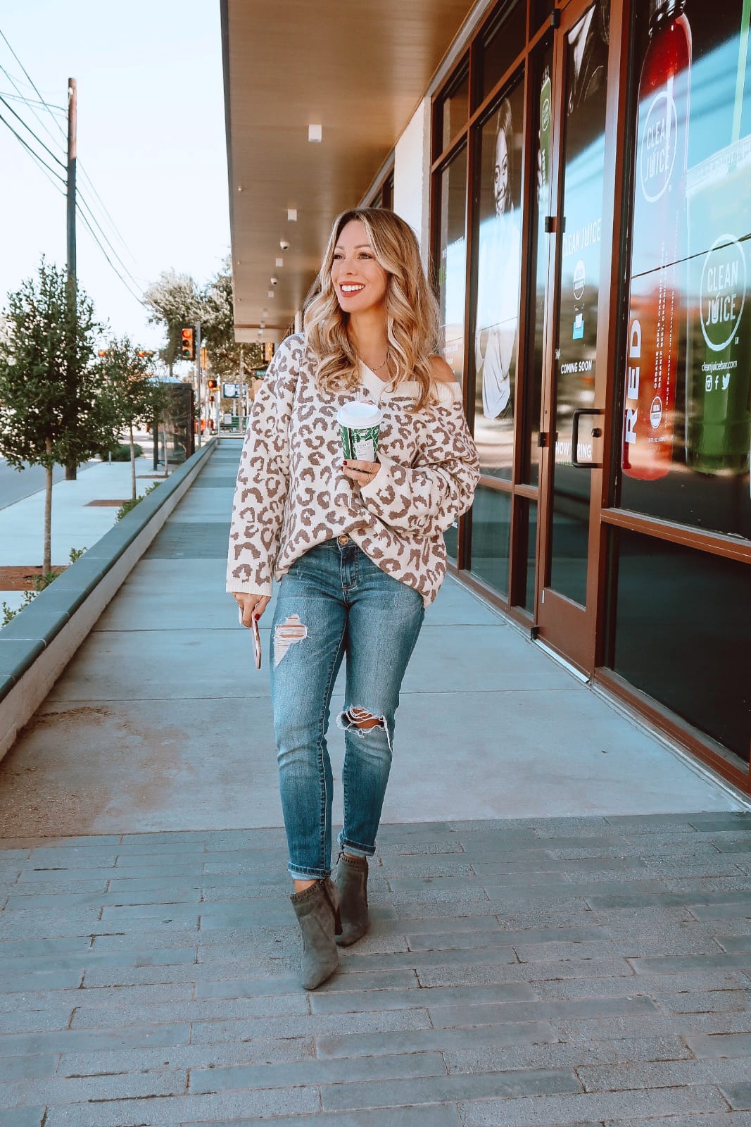 Winter outfit - leopard sweater ripped jeans and grey booties