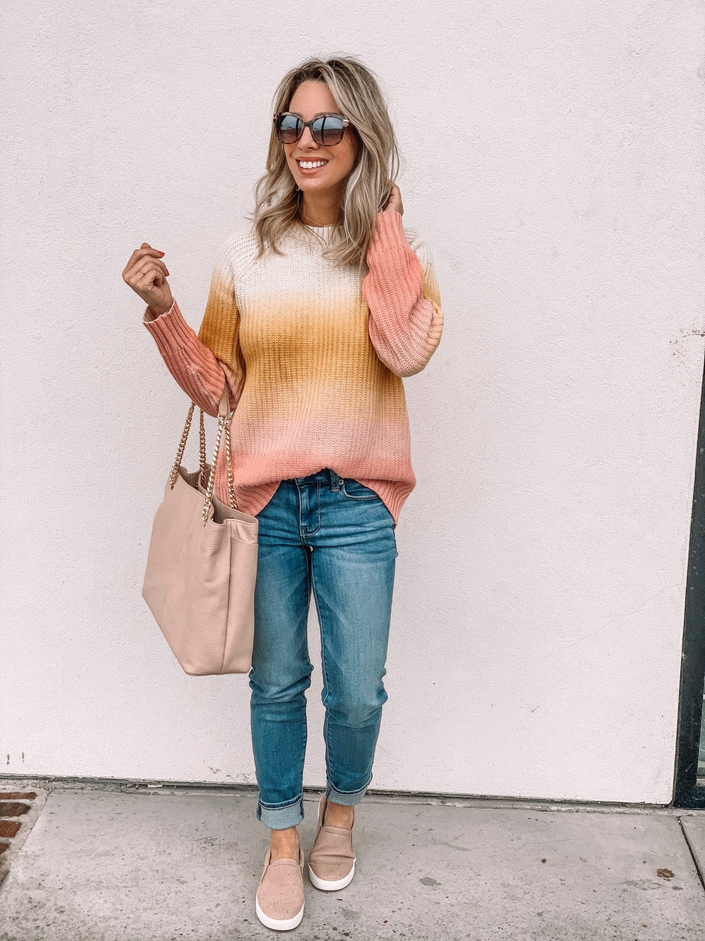 Jeans and striped sweater with pink slip on sneakers