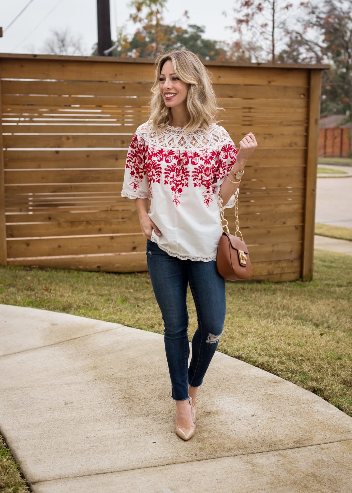 Jeans and red and white embroidered top