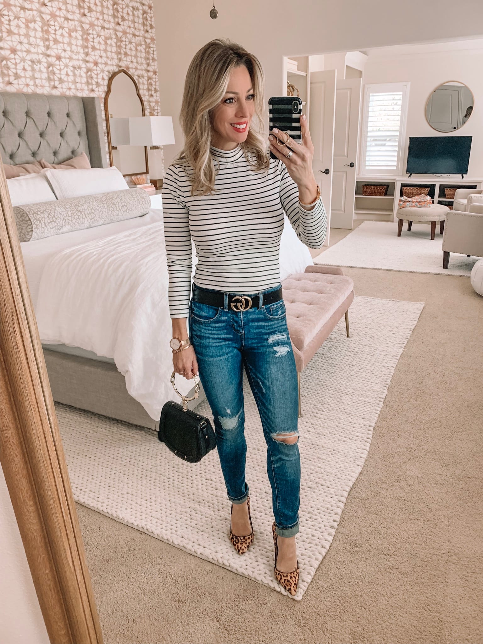 Cute night out outfit - striped top, distressed jeans and leopard heels