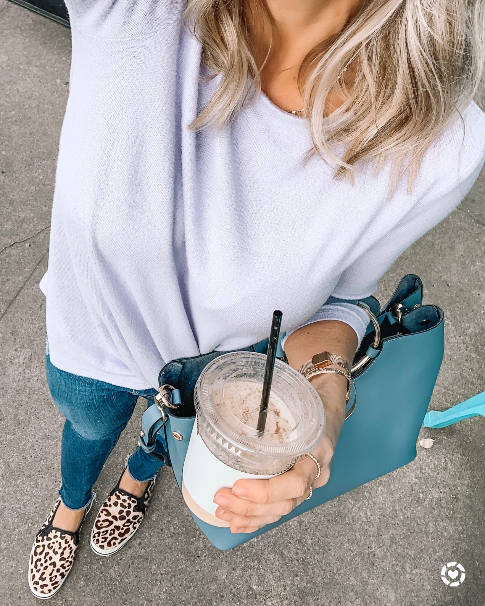 twist pullover and jeans with leopard sneakers