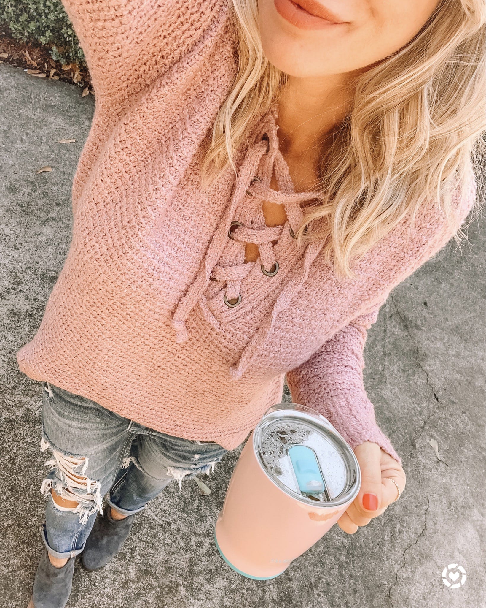 lace up sweater and ripped jeans