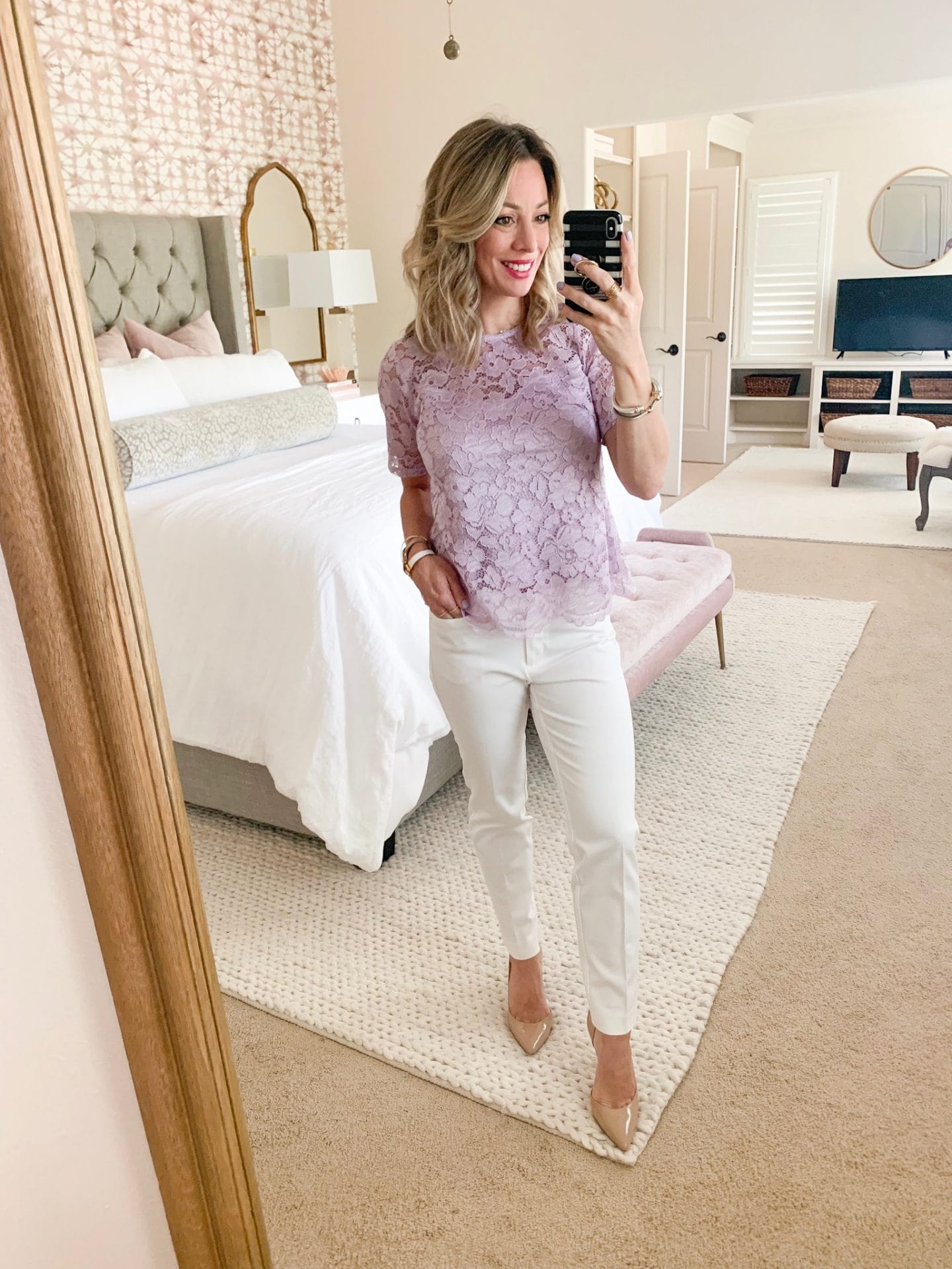 White pants and lavender lace top