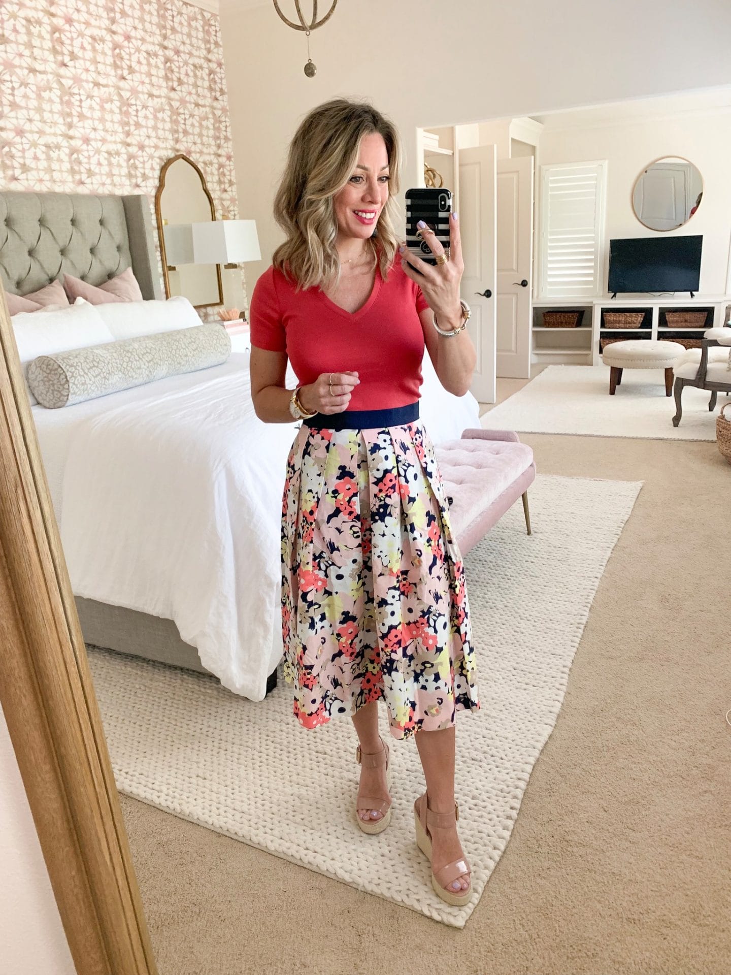 floral skirt and pink v-neck tee