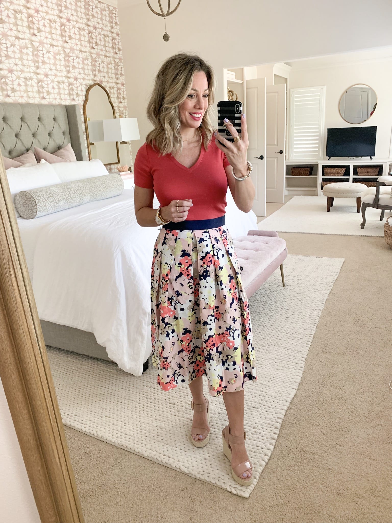 floral skirt and pink v-neck tee