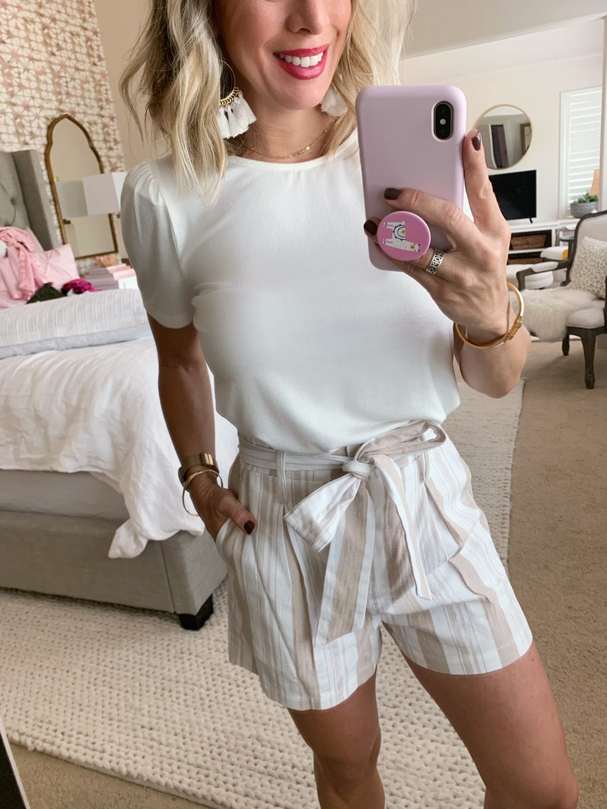 belted paper bag shorts and white tee