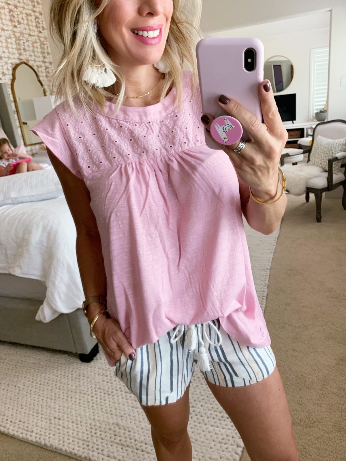 striped shorts and pink tee