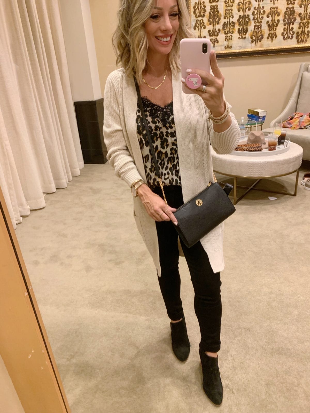 Nordstrom Anniversary Sale - leopard cami with a cream cardigan and black jeans with black boots with a Tory Burch crossbody