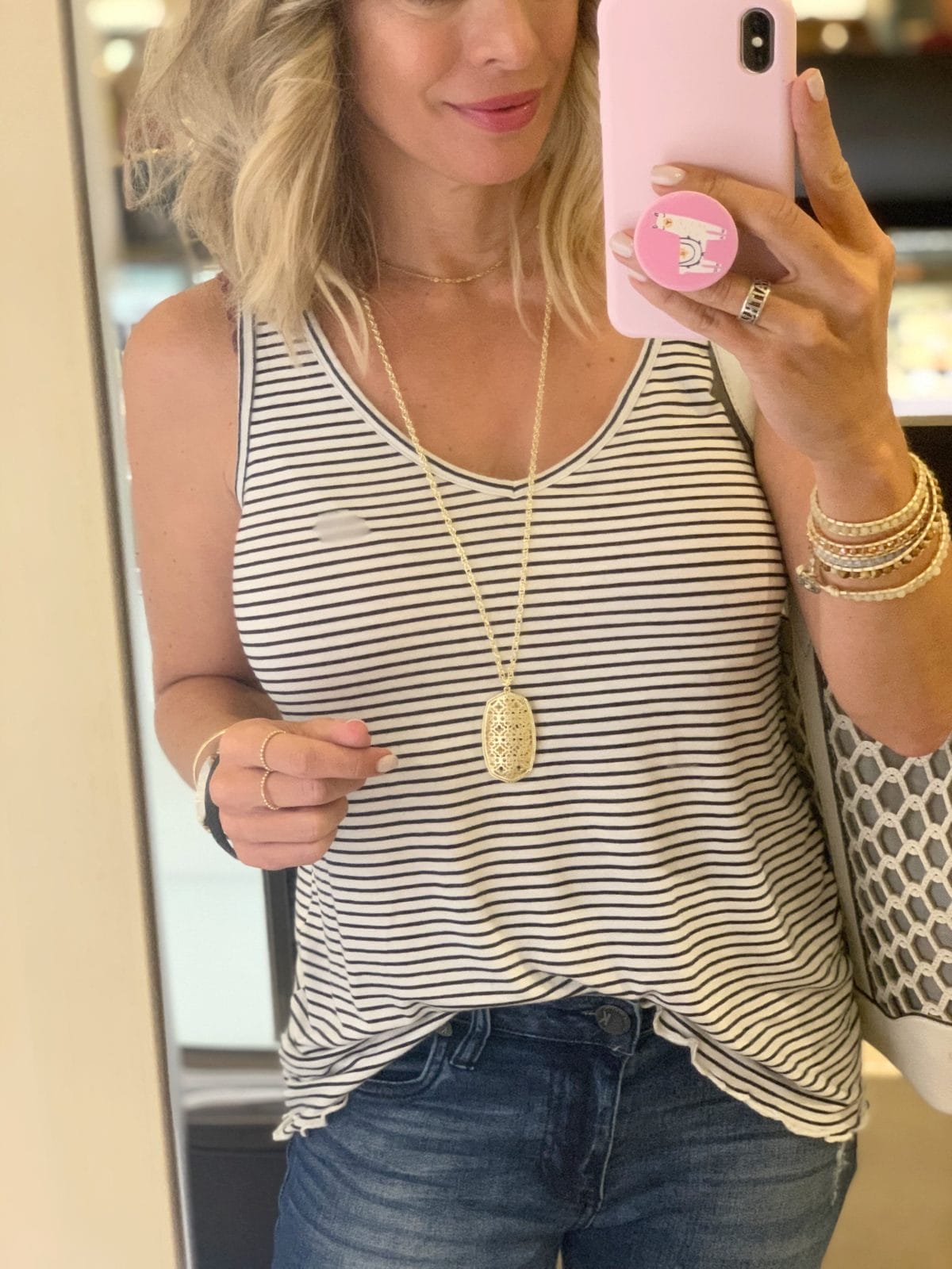 Nordstrom Anniversary Sale - stripe tank with jeans and a long gold pendant necklace