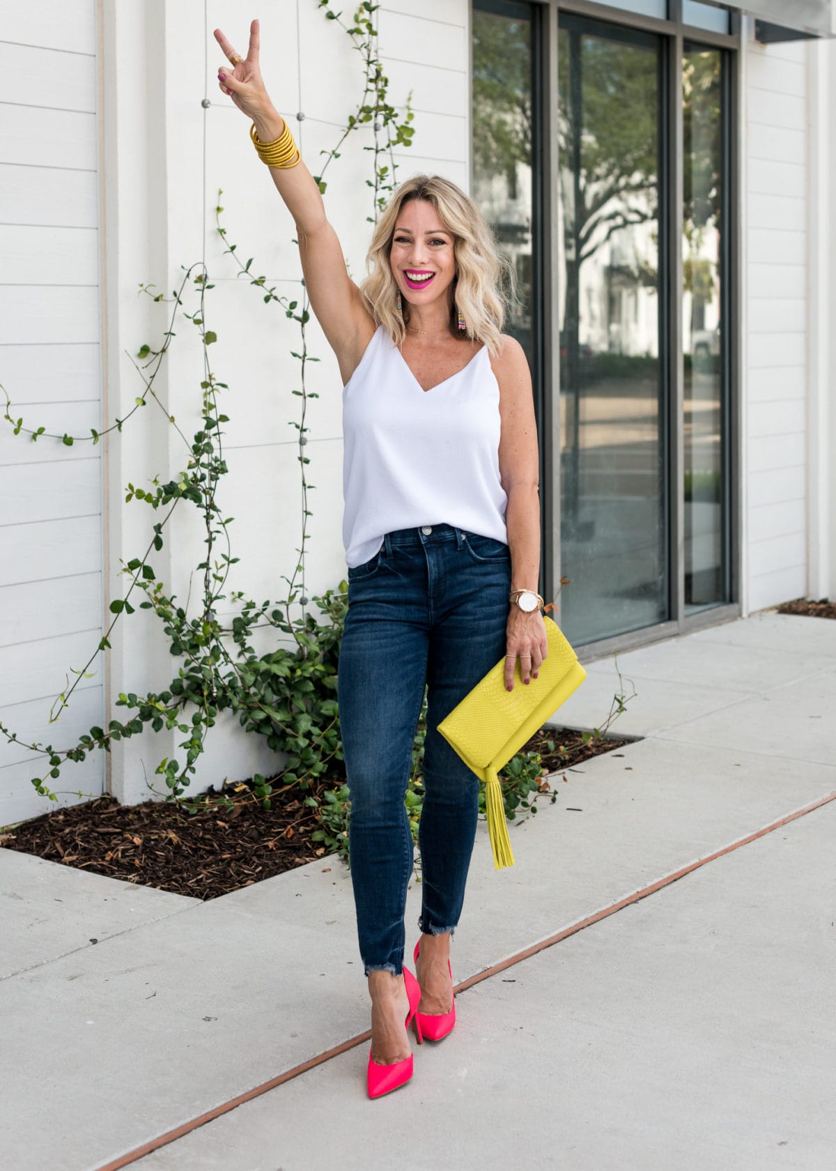 Jeans and cami with neon shoes and bag
