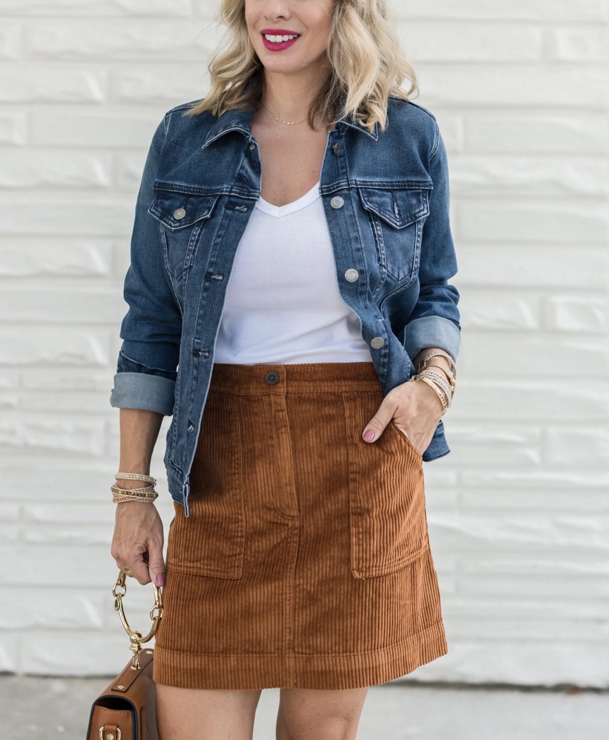 white t-shirt with corduroy skirt and jean jacket