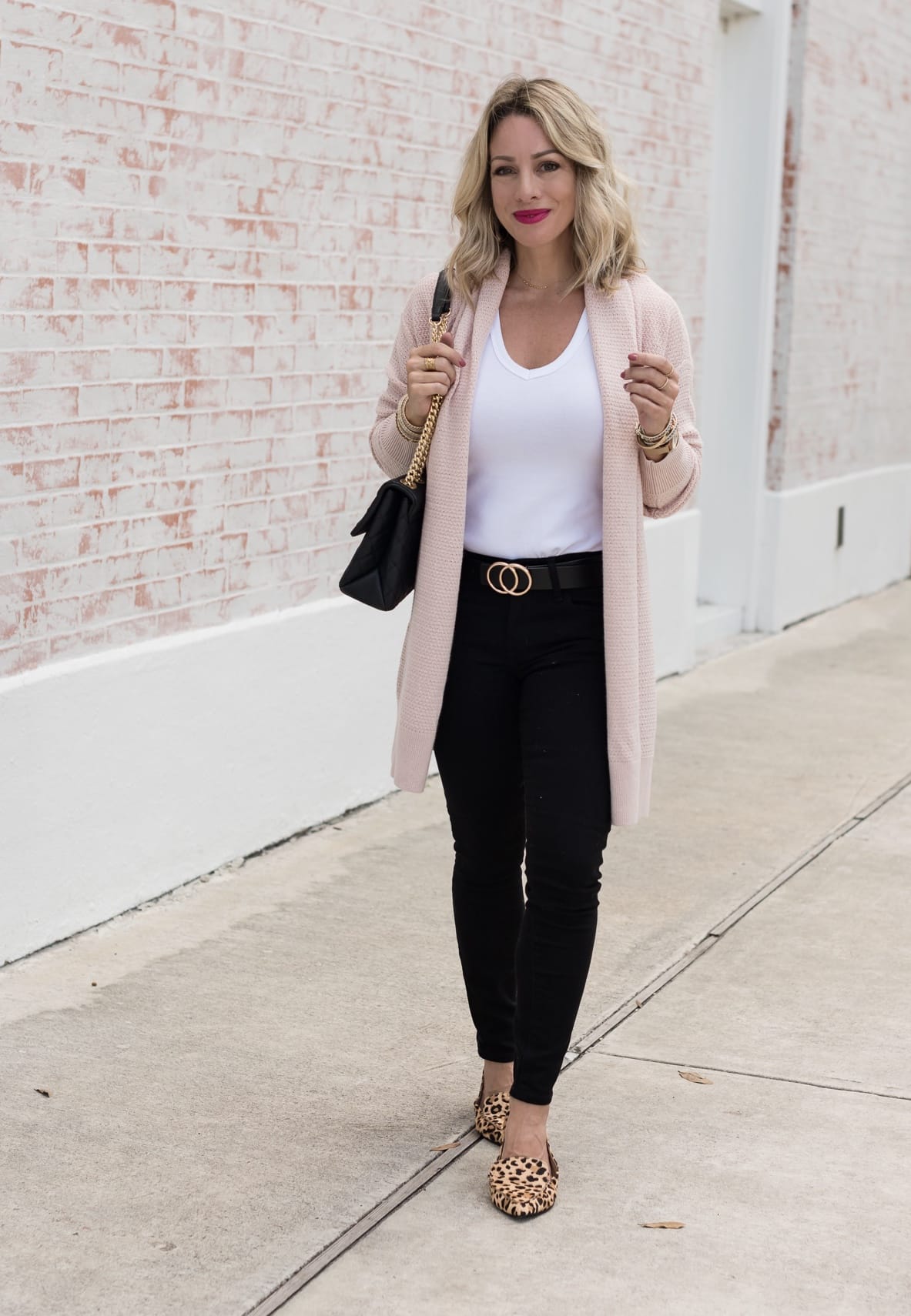 white t-shirt with black jeans and pink cardigan