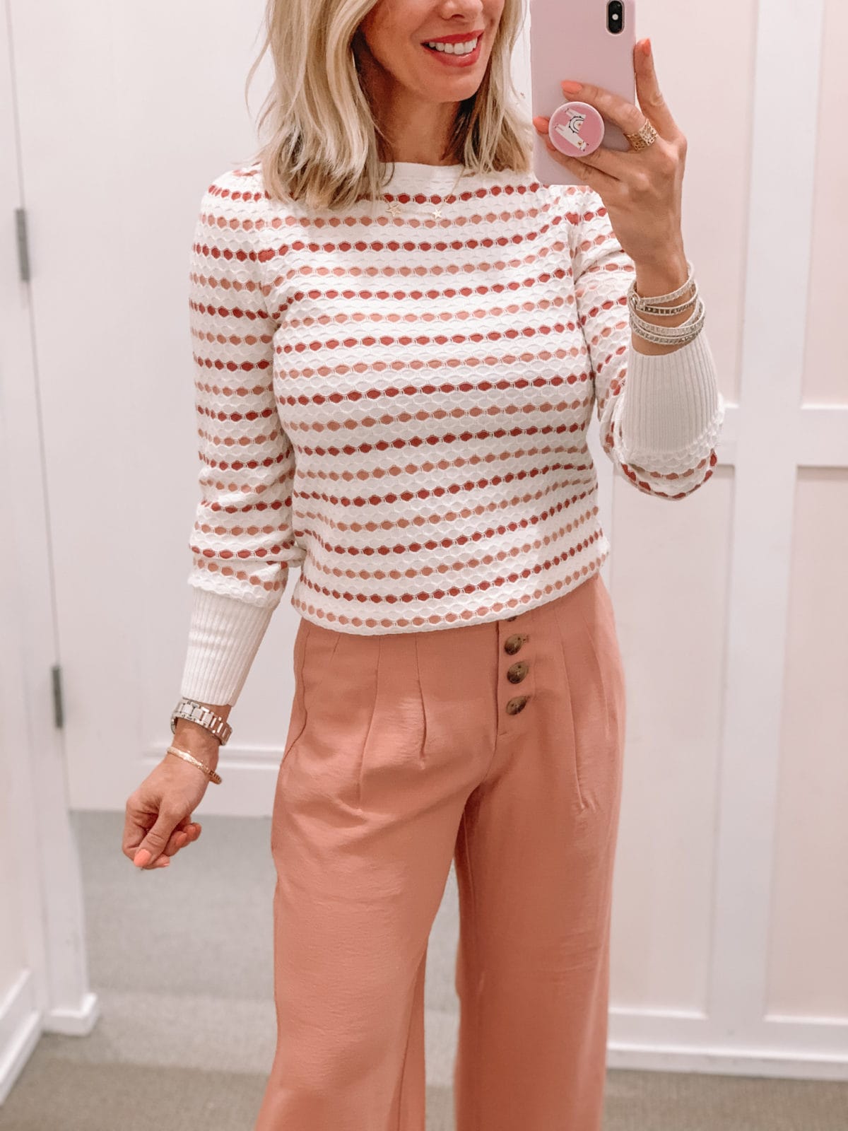 dot sweater and pink pants