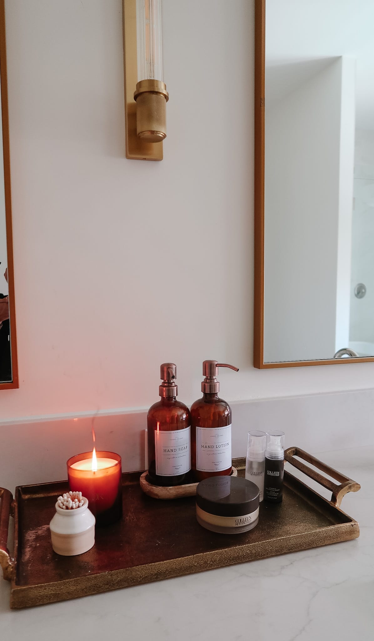 Wooden Tray, amber soap dispensers, candle, matches, metal tray. 