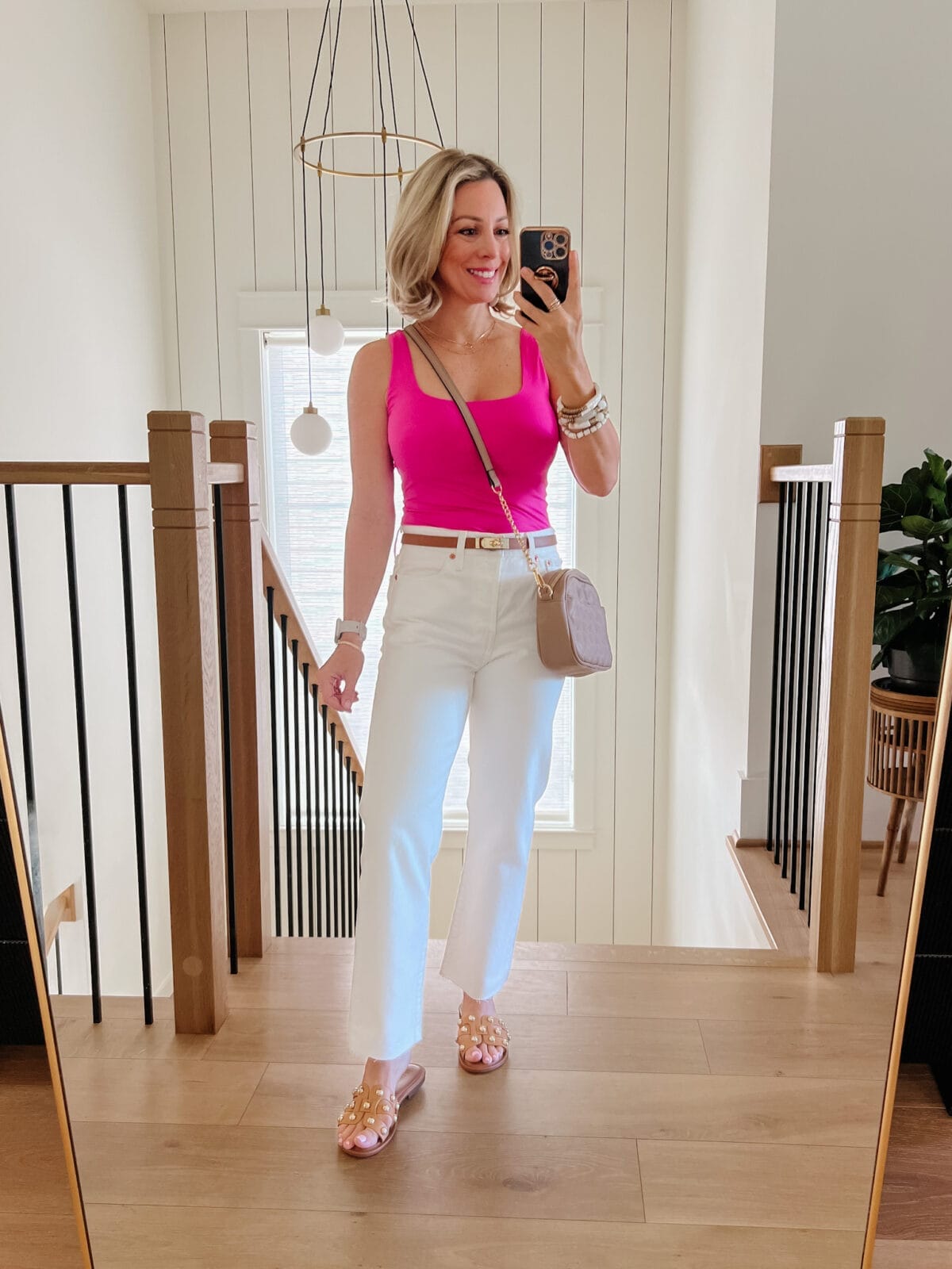 Pink Pumiey Tank, White Jeans, Sandals 