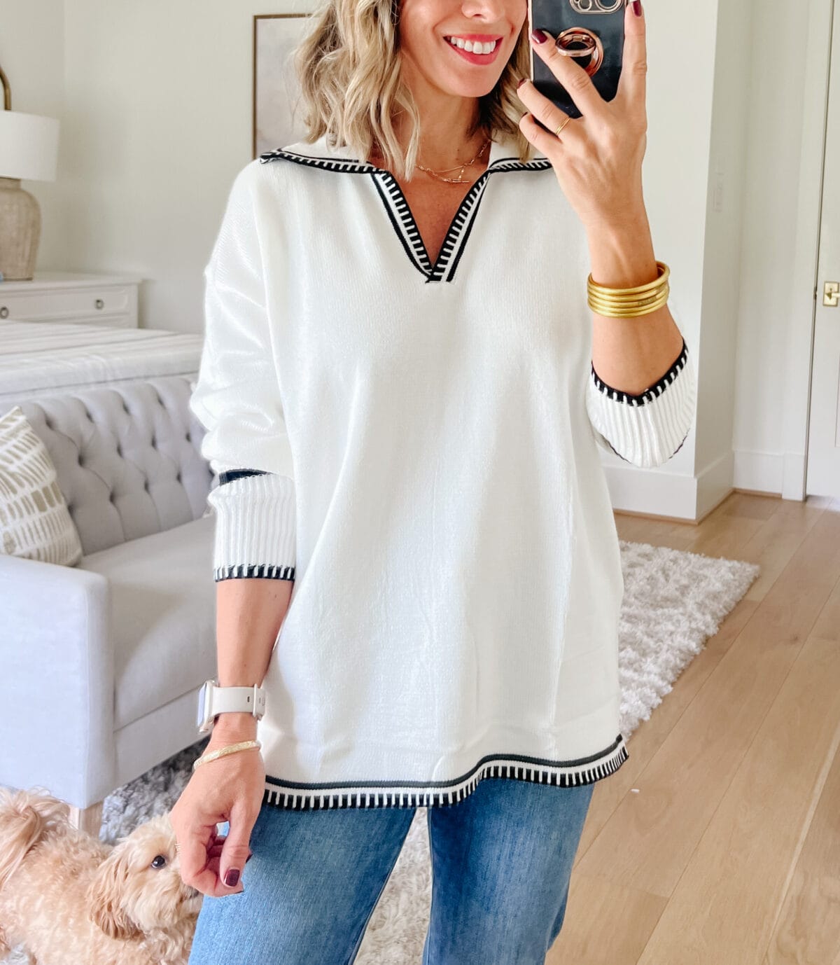 White wide collared sweater, pistola jeans, booties 